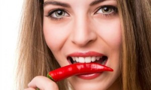 FIwoman-biting-chili-pepper