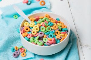 bowl of colorful cereal on teal towel