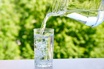 water poured from pitcher outside