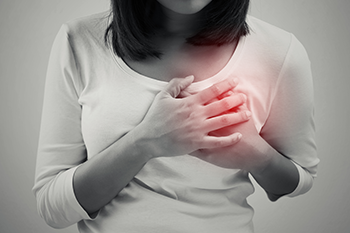 woman having a heart pain stress affects body