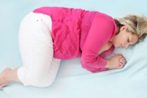 woman sleeping on bed winter weight gain