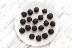 cacao truffles on white plate