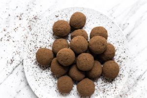 cacao truffles on white plate