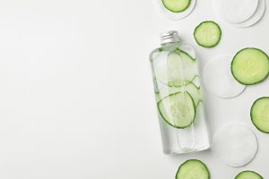 cucumber infused water on white background